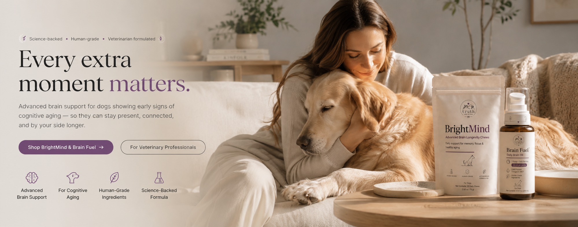 A woman resting her cheek on a golden retriever with BrightMind and Brain Fuel on a warm oak table.